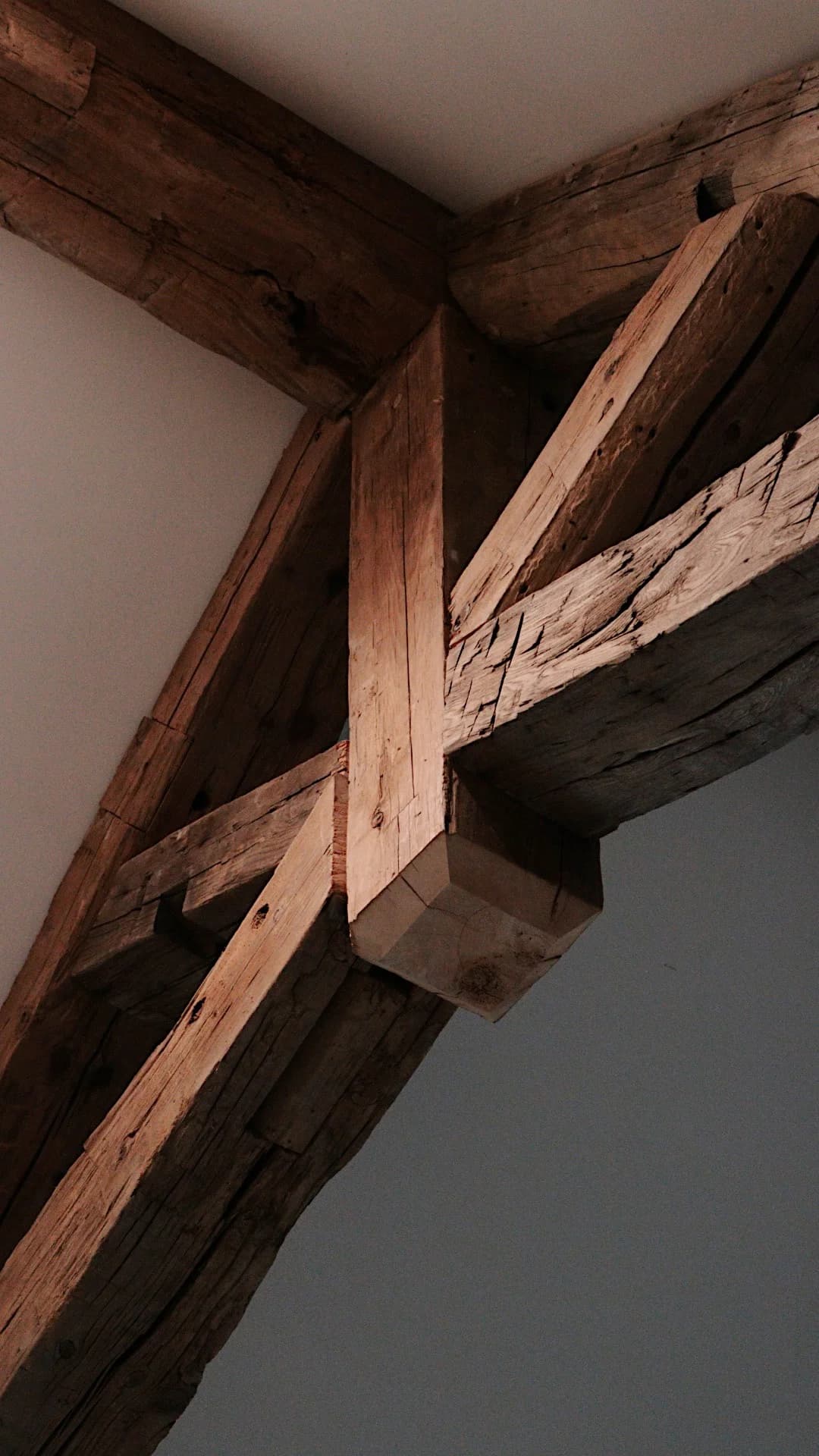 Close-up of natural timber beams and their handcrafted joinery
